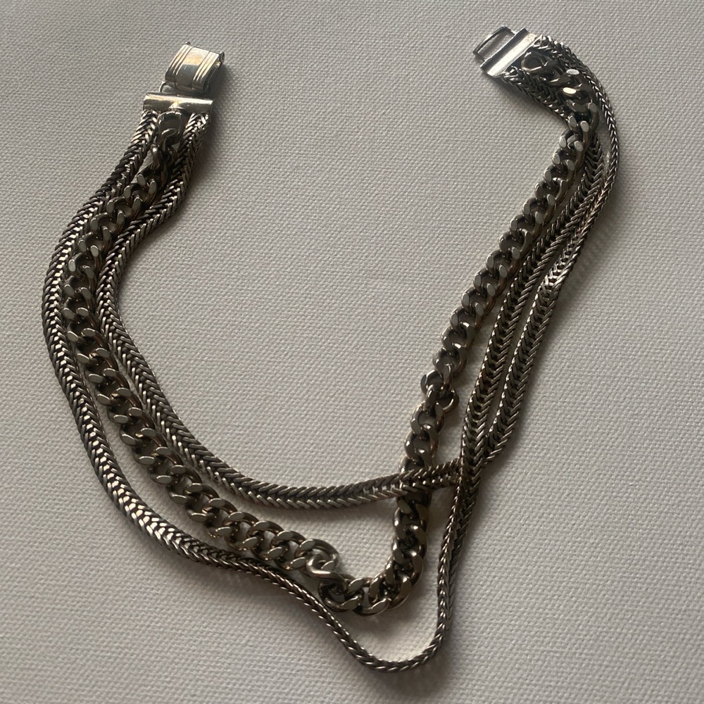 Coro Silver tone platinum three strain s chains choker. Folded snap closure. 14”